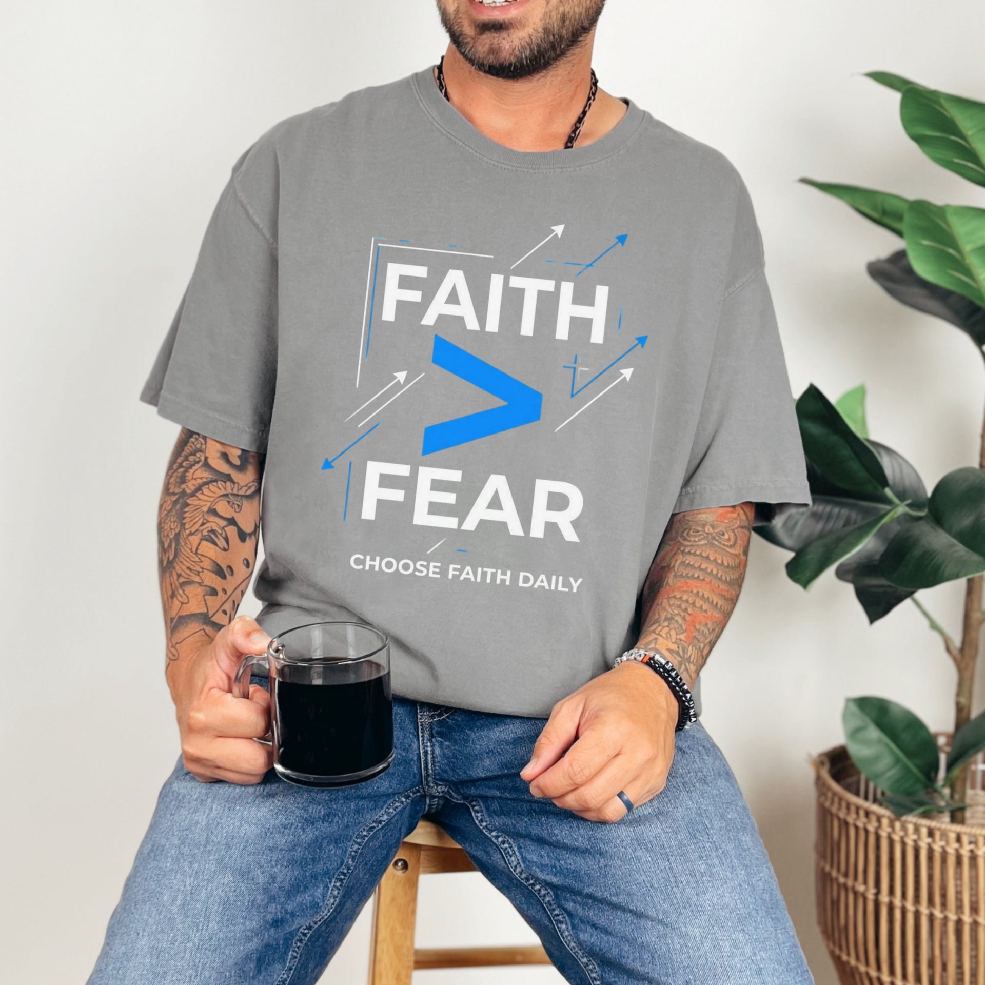 Person wearing a Faith > Fear T shirt, promoting faith over fear t shirt with a relaxed style.