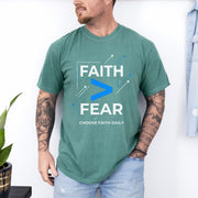 Man wearing Faith > Fear T shirt, inspiring courage with faith over fear t shirt design.