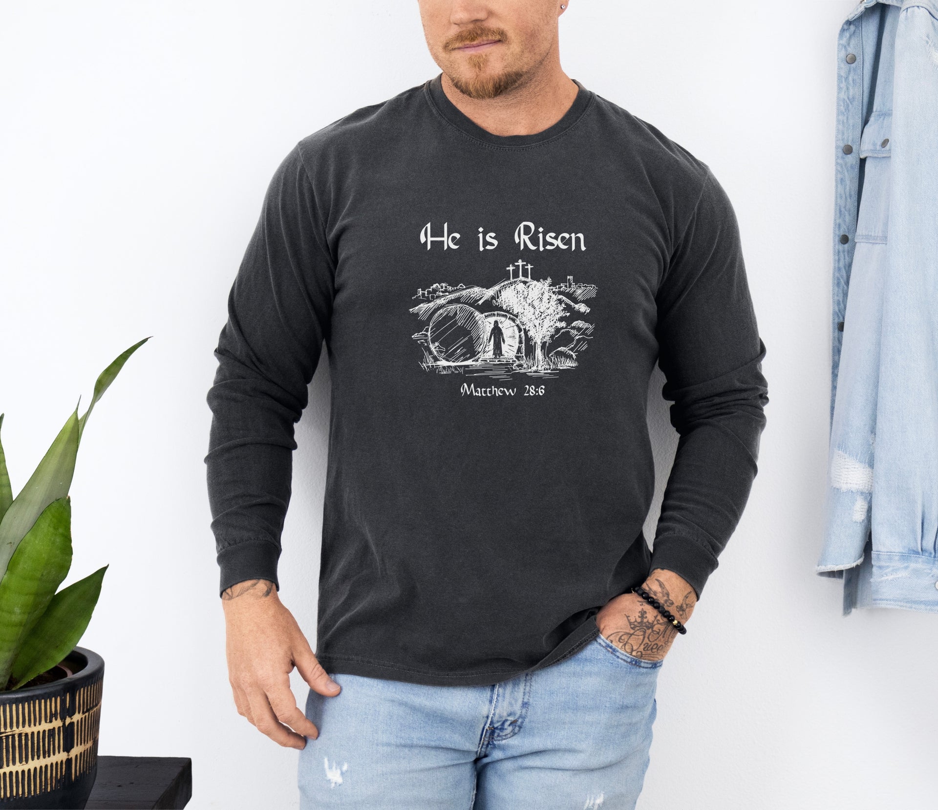 He Is Risen long sleeve t-shirt featuring a resurrection graphic and Matthew 28:6, perfect for celebrating Easter.