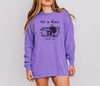 He Is Risen long sleeve t-shirt in purple featuring Matthew 28:6 print; a reminder of Christ's resurrection.