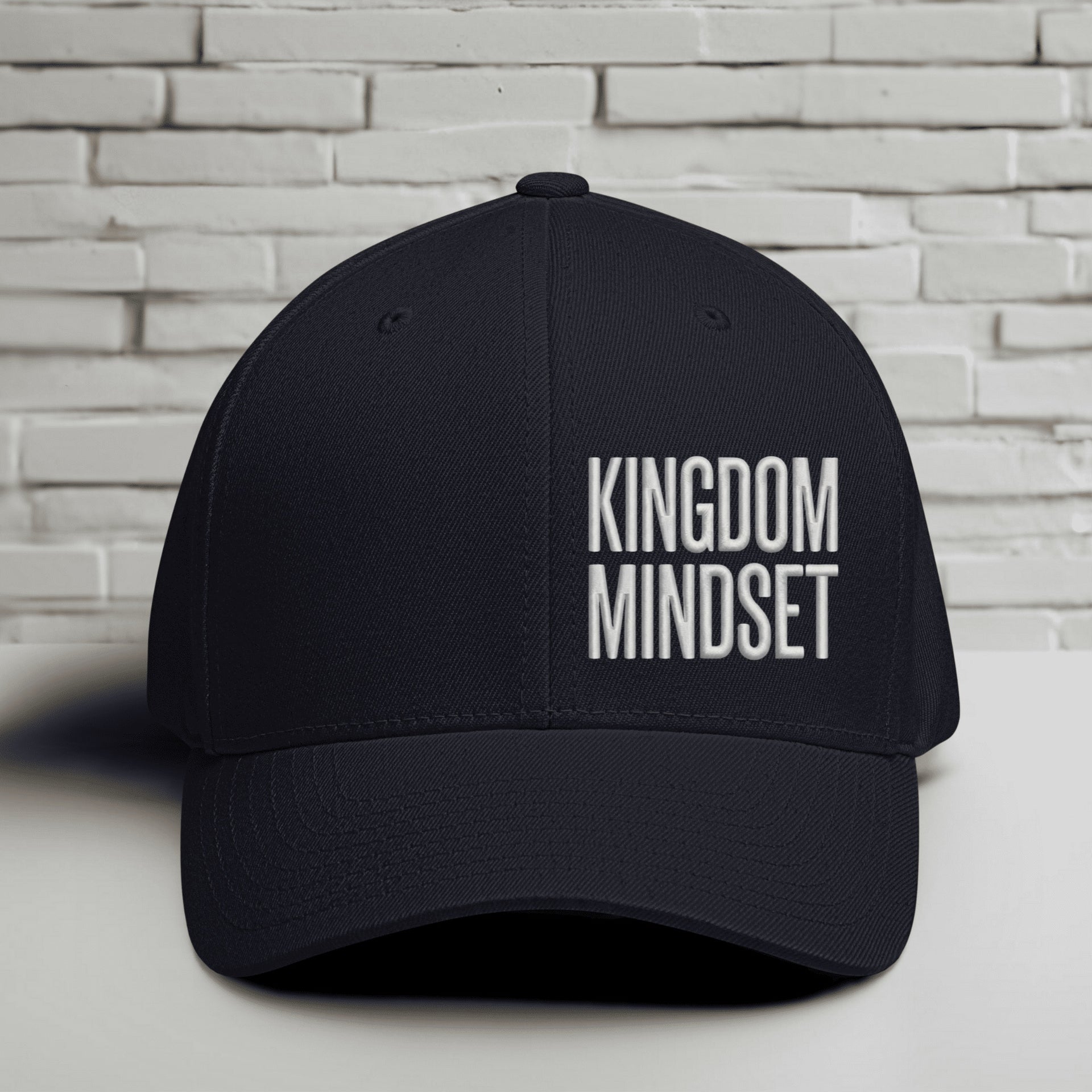 Flexfit Kingdom Mindset hat in dark navy with white embroidery on a structured cap, ideal for casual wear.