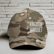 Flexfit Kingdom Mindset hat in Multicam Green with white lettering on a camouflage background.