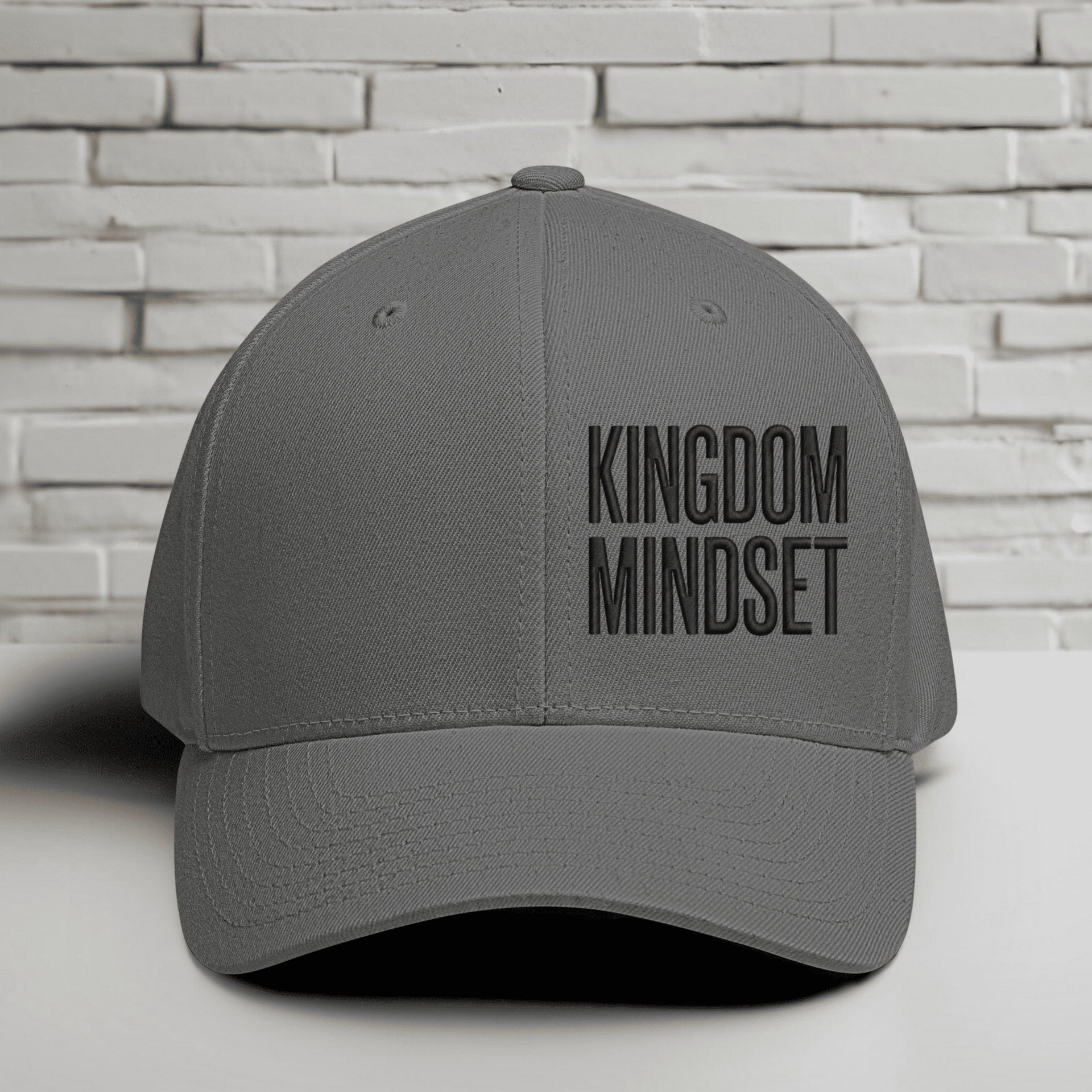 Flexfit Kingdom Mindset Embroidered Hat in grey, showcasing bold lettering, perfect for casual wear and workouts.