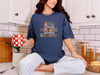 Navy Christian autumn graphic t-shirt featuring Jesus Flannels Pumpkins Sweaters Blessings, perfect for fall celebrations.