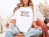 Pumpkin Spice and the Spirit of Christ T-Shirt in white worn by a woman holding a mug, celebrating fall and faith.