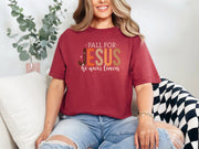 Fall for Jesus graphic tee in chili color worn by a model, featuring autumn-themed text and cozy fall vibes.