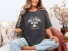 Woman wearing a pepper Foll-o-ween Jesus t-shirt, holding a mug, showcasing a festive Christian graphic.