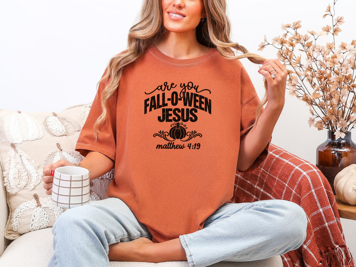 Are You Foll-o-ween Jesus t-shirt in yam color worn by a woman, featuring a playful design and scripture reference.