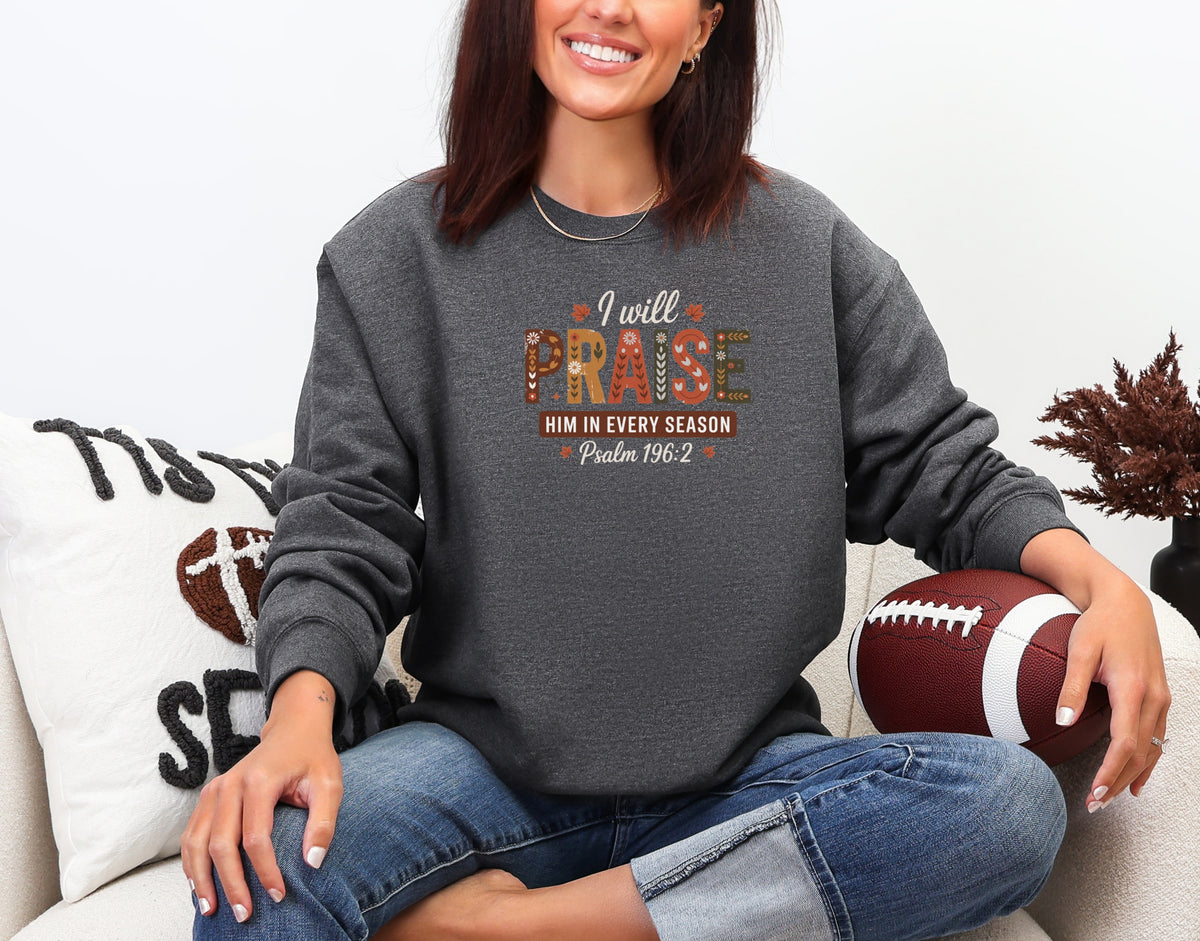 Dark Heather Christian faith sweatshirt with 'I Will Praise Him in Every Season' design, perfect for celebrating faith.